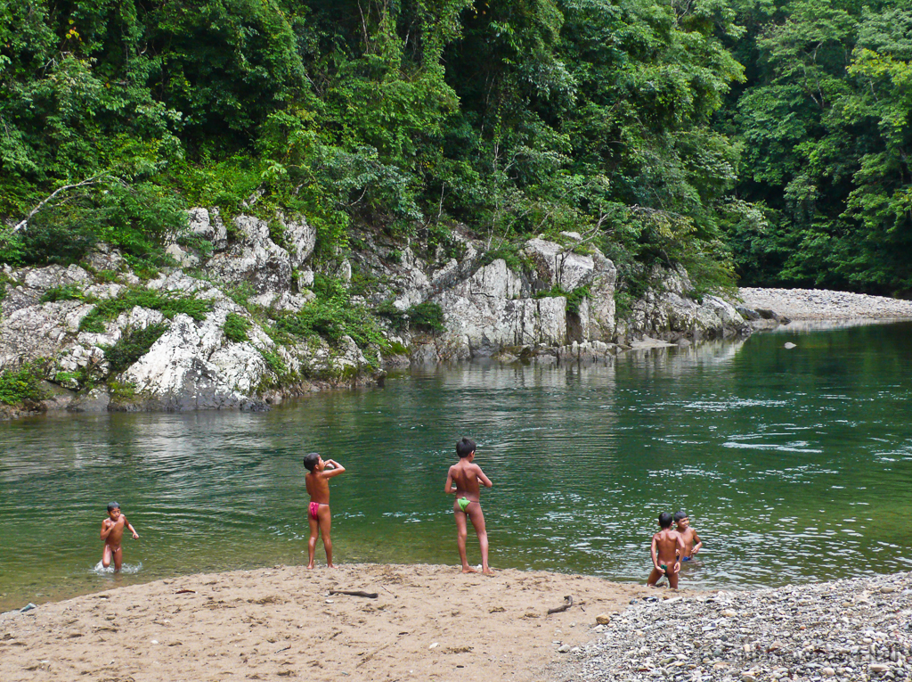 Boys play along the Chagres River in the 320,000 acre Chagres National Park