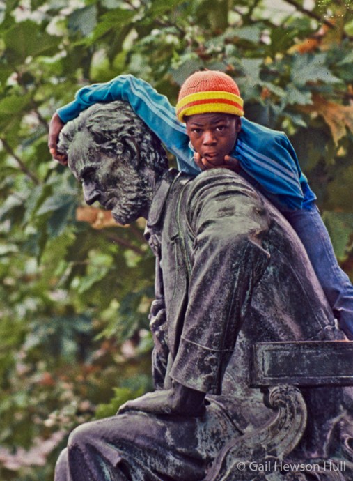 Boy watching Harvest Day Parade, 1979, from San Francisco City Hall, Lincoln statue perch